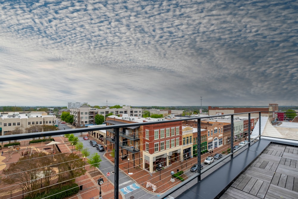 a balcony with a view of a city