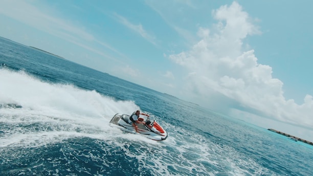 a man riding a jet ski on top of a body of water