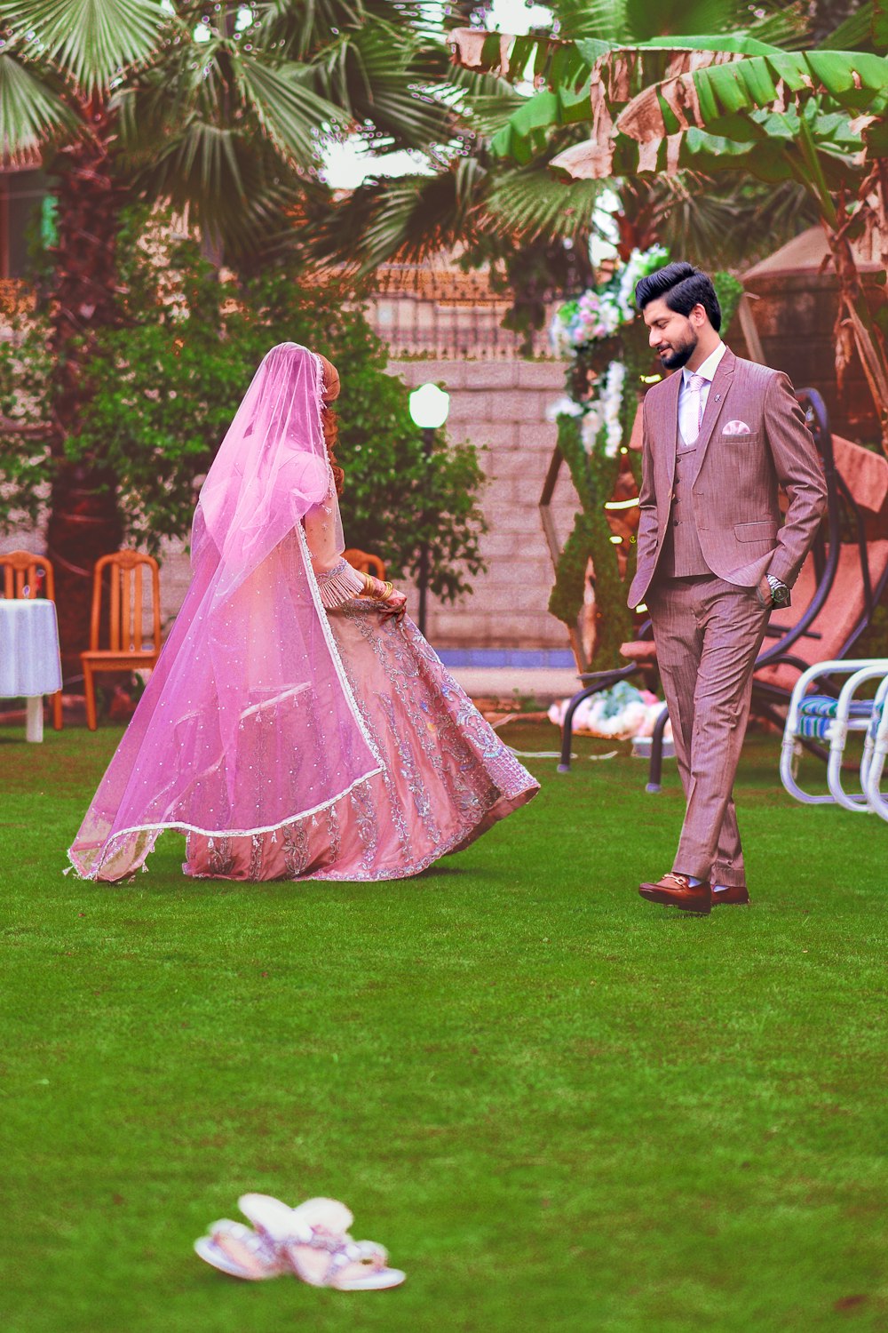 a man and a woman dressed in wedding attire