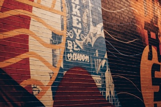 A vibrant mural on a city wall showcasing abstract art.