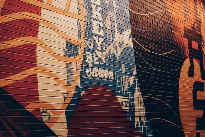 A vibrant mural on a city wall showcasing abstract art.