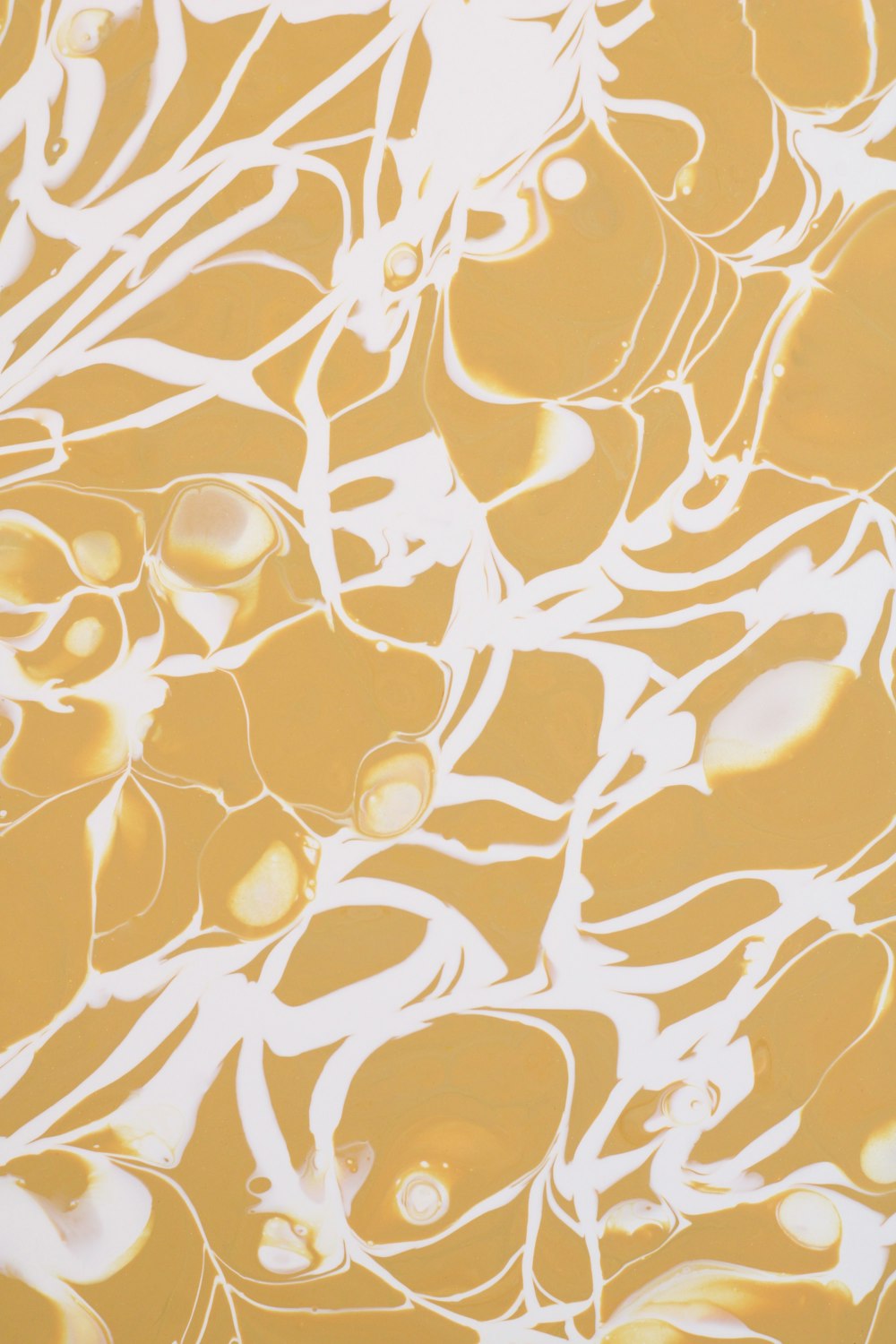 an abstract painting with yellow and white colors