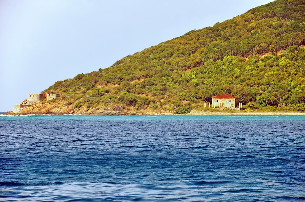 a house on a hill overlooking a body of water