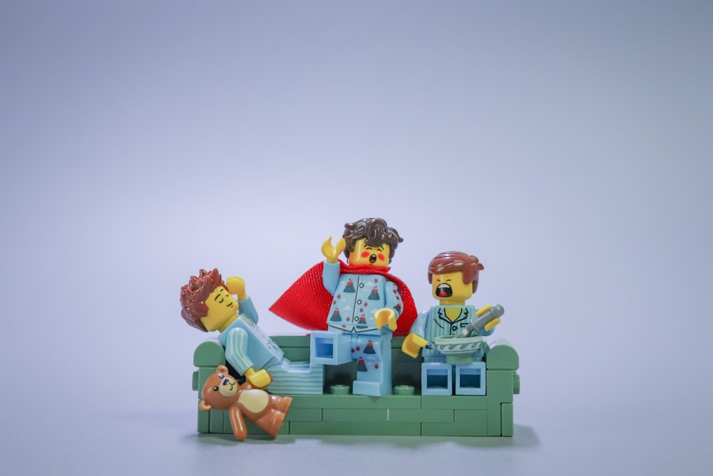 a group of lego figures sitting on top of a table