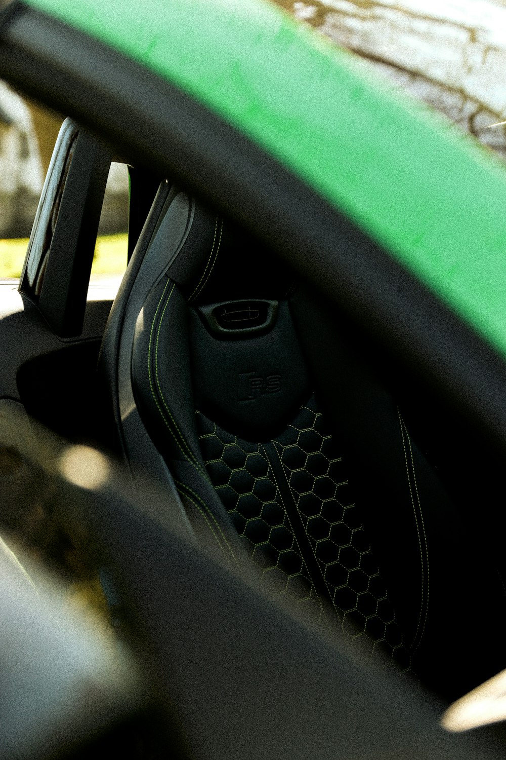 a close up of a car's dashboard with a surfboard in the background