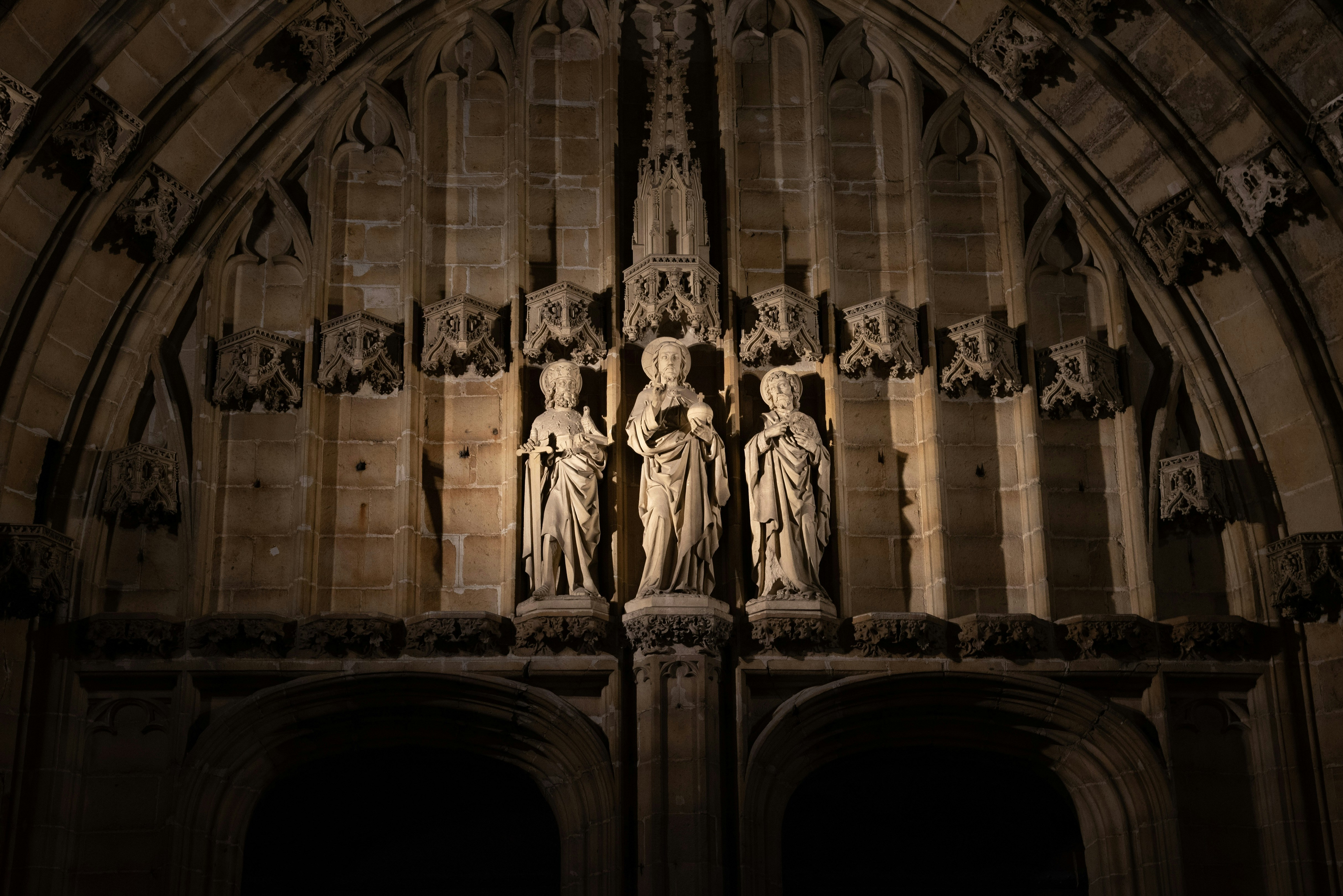 a large cathedral with statues on the side of it