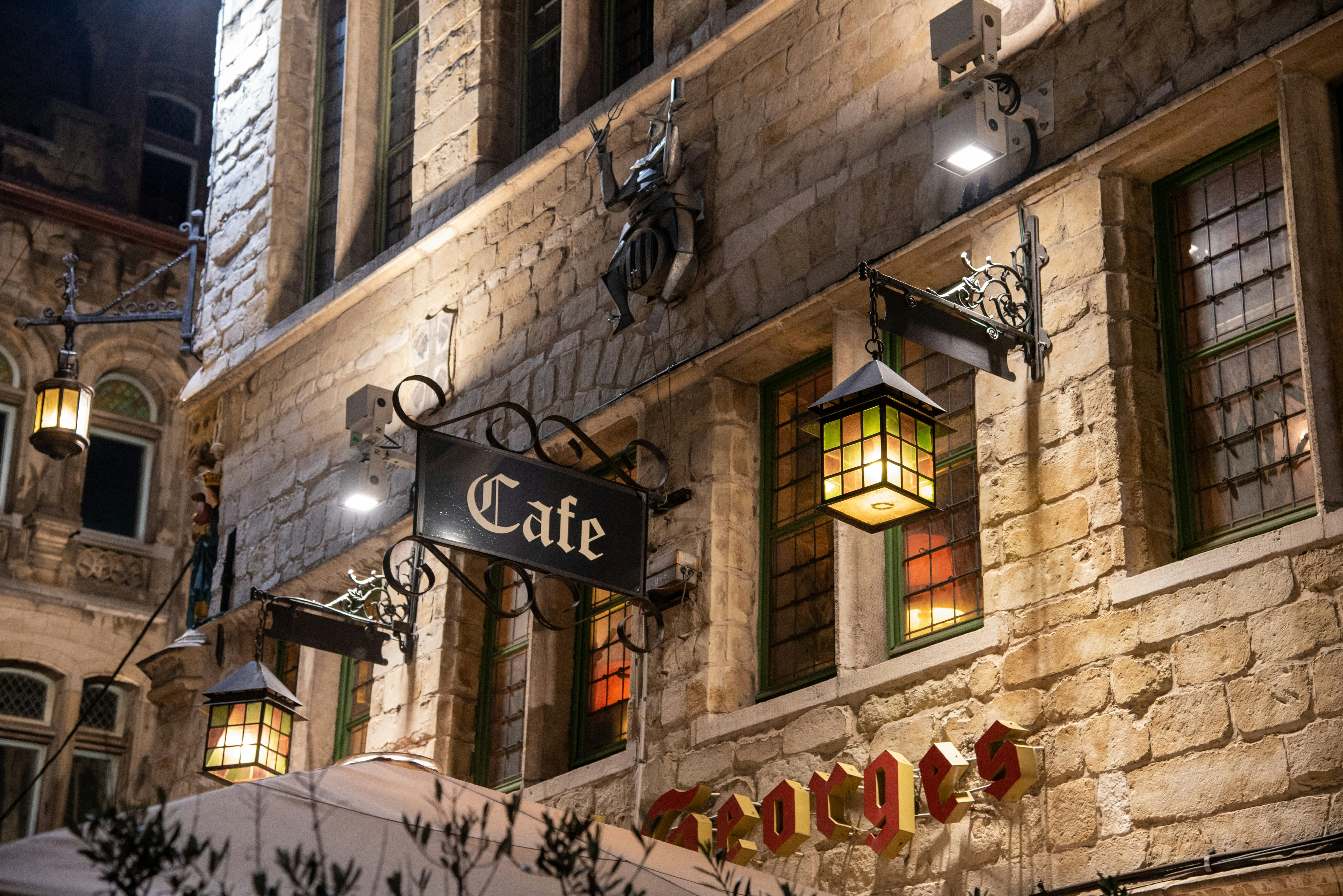 a building with a sign that says cafe on it