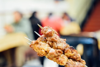 a close up of a skewer of food on a stick