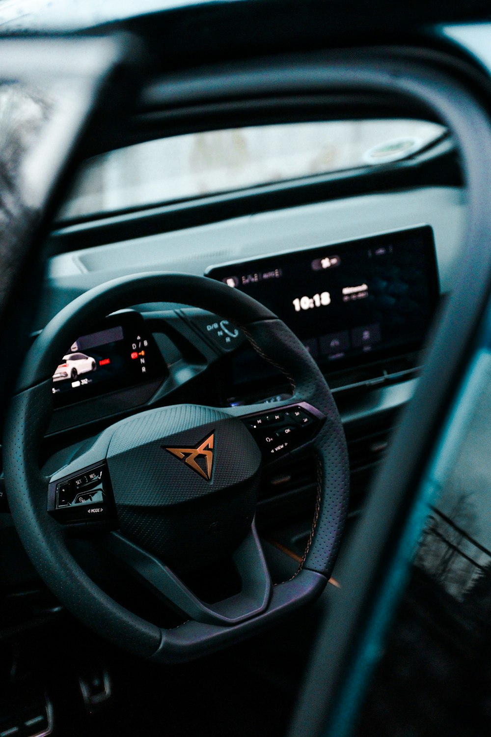 a steering wheel and dashboard of a car