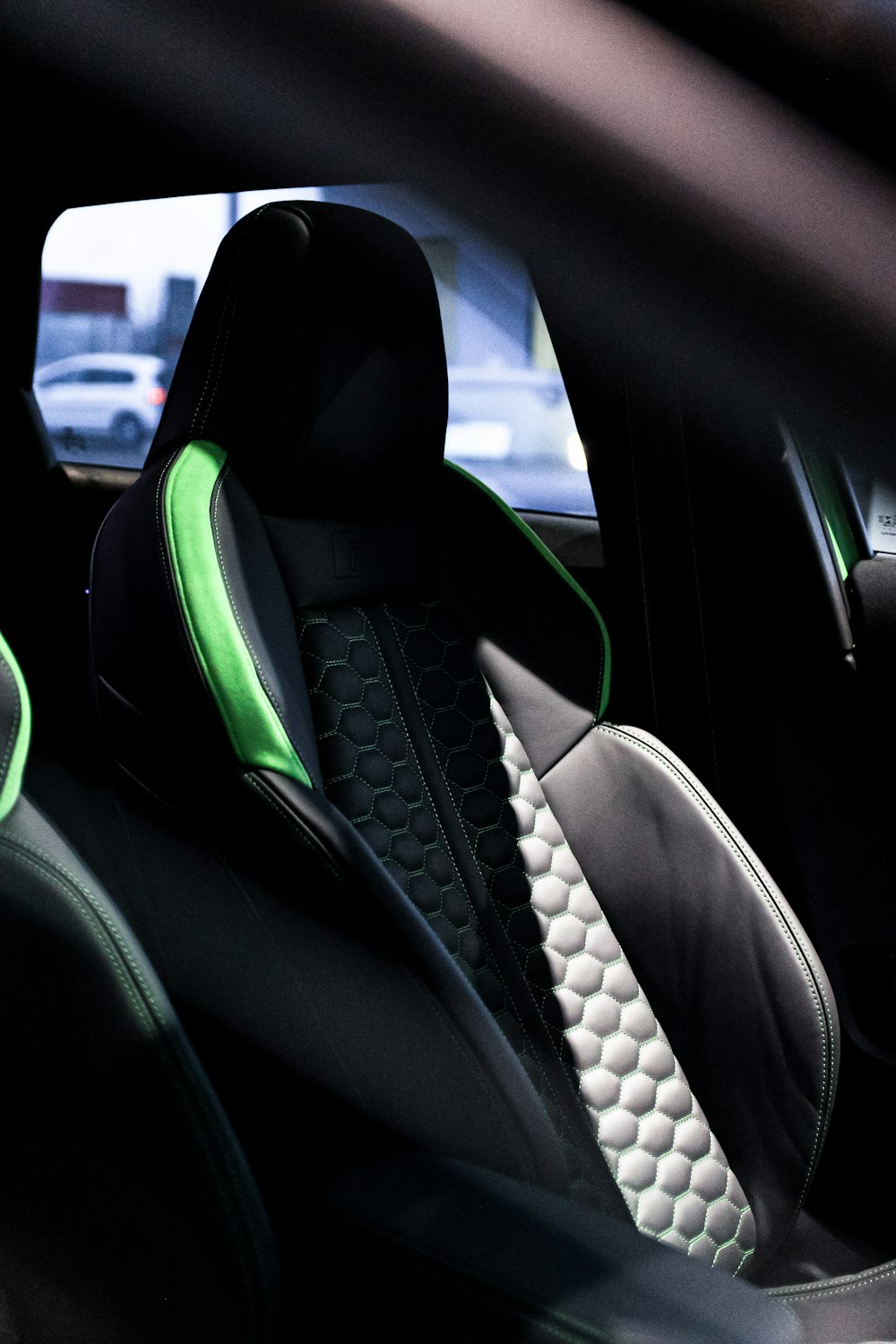 a close up of a car's seats with neon green trim