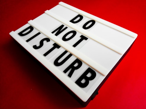 a sign that says do not disturb on it
