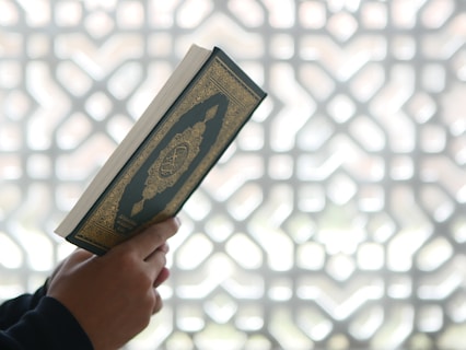 a person holding a book in their hands