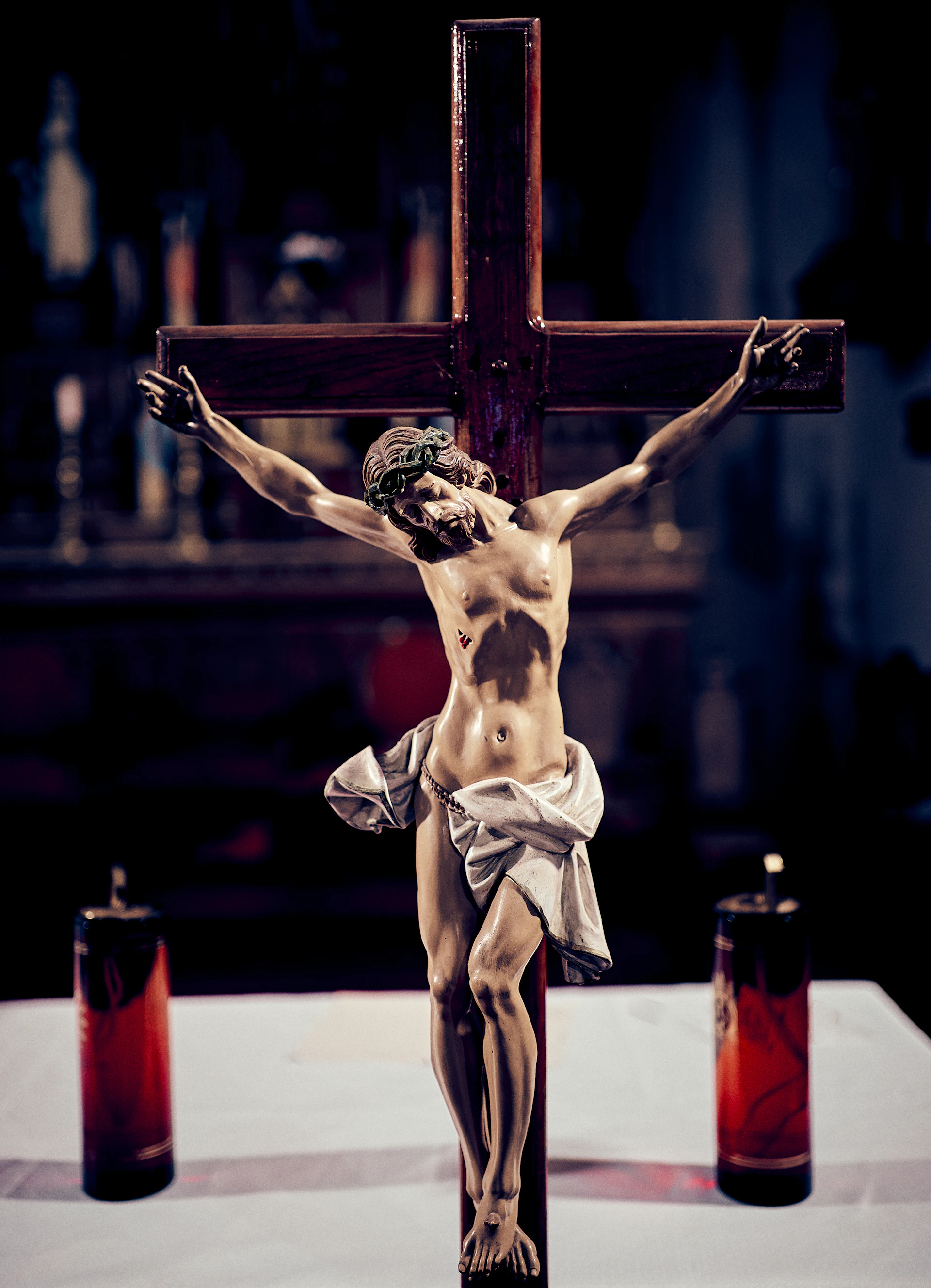 a statue of jesus on a wooden cross