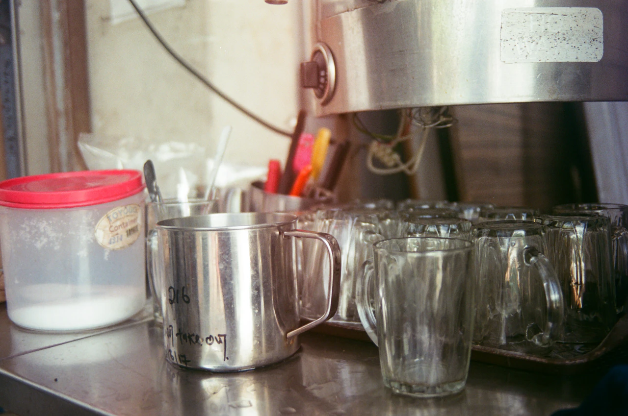 Cups lined up on a coffee shop counter