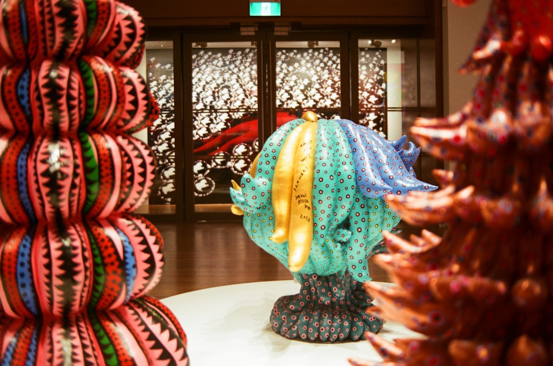 a group of colorful sculptures sitting on top of a white table,