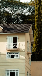a house with a balcony and a balcony railing