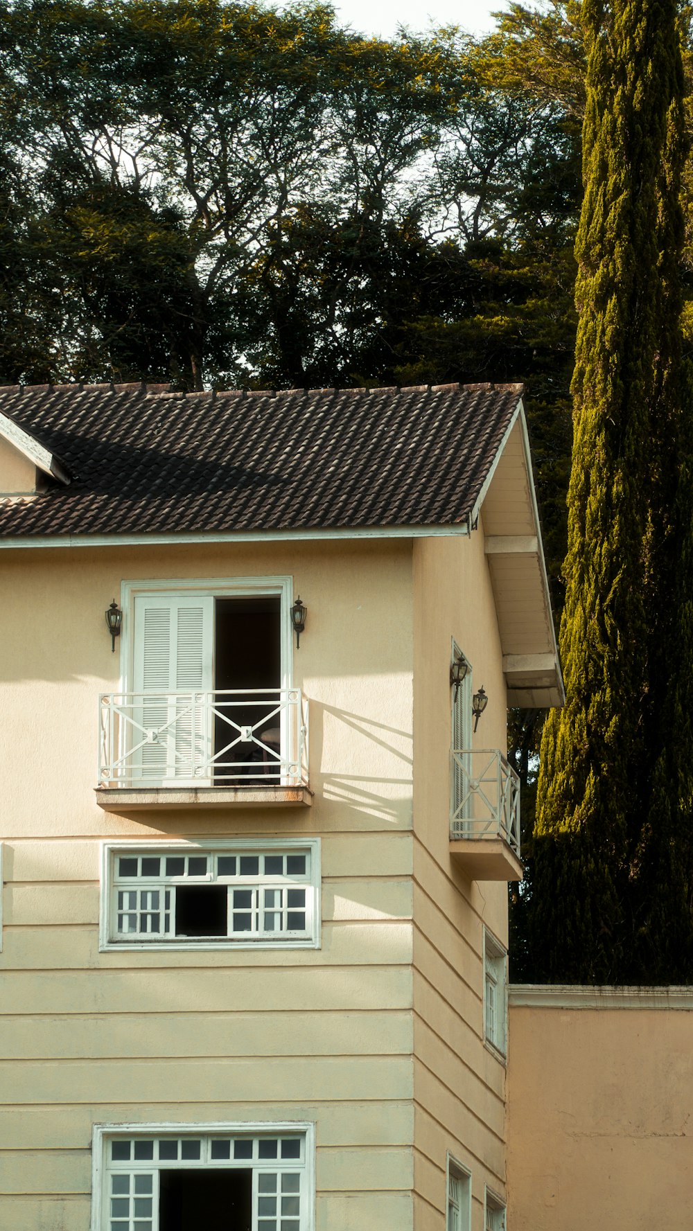 a house with a balcony and a balcony railing