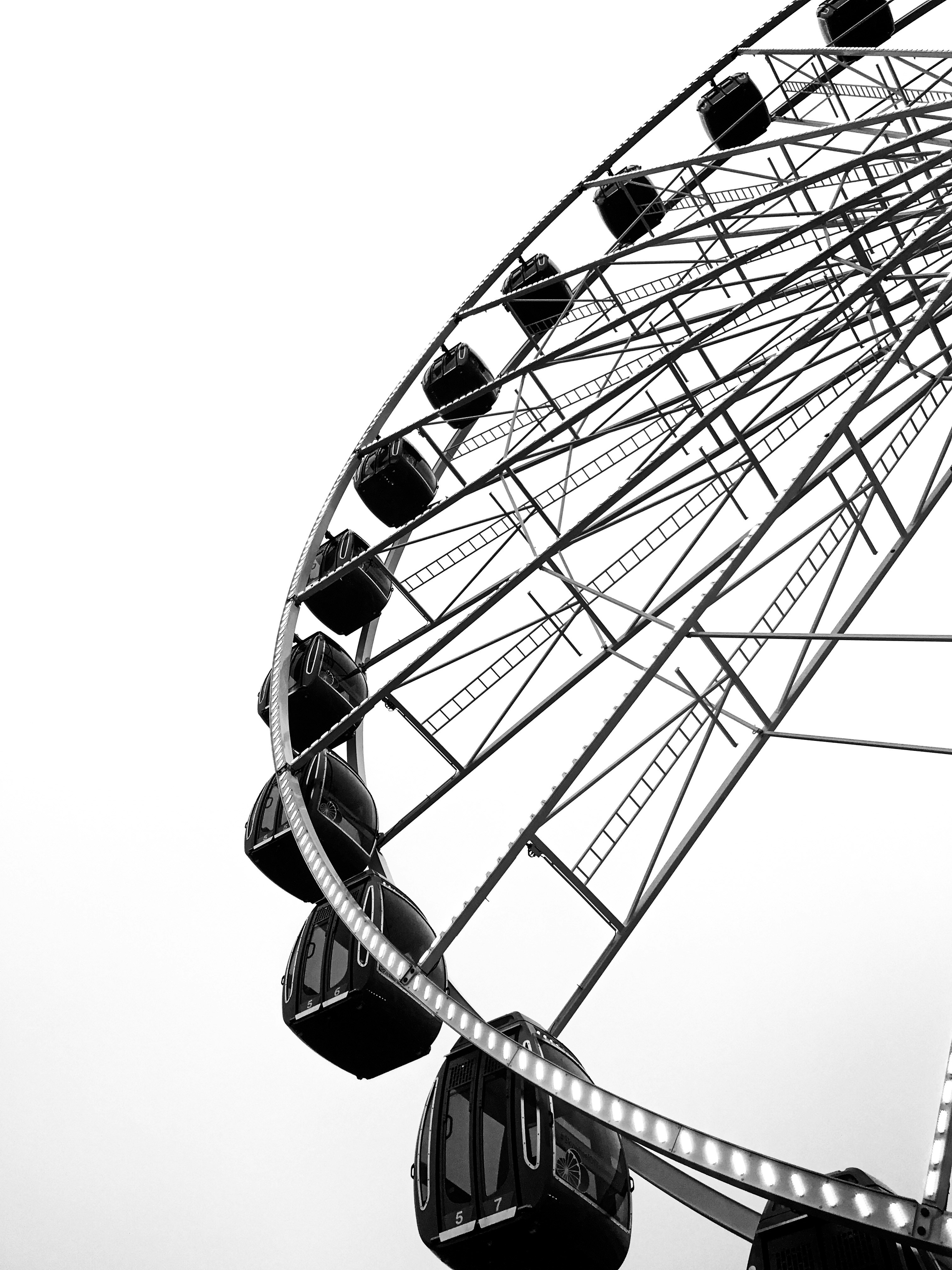 a black and white photo of a ferris wheel
