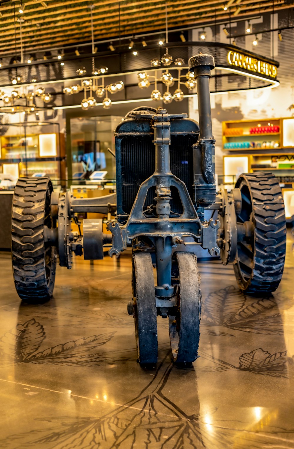 an old tractor is on display in a museum