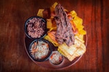 Delicious traditional Brazilian dishes beautifully arranged on a rustic wooden table.