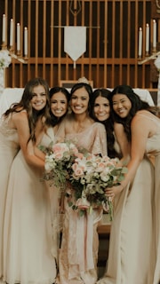 a group of women standing next to each other