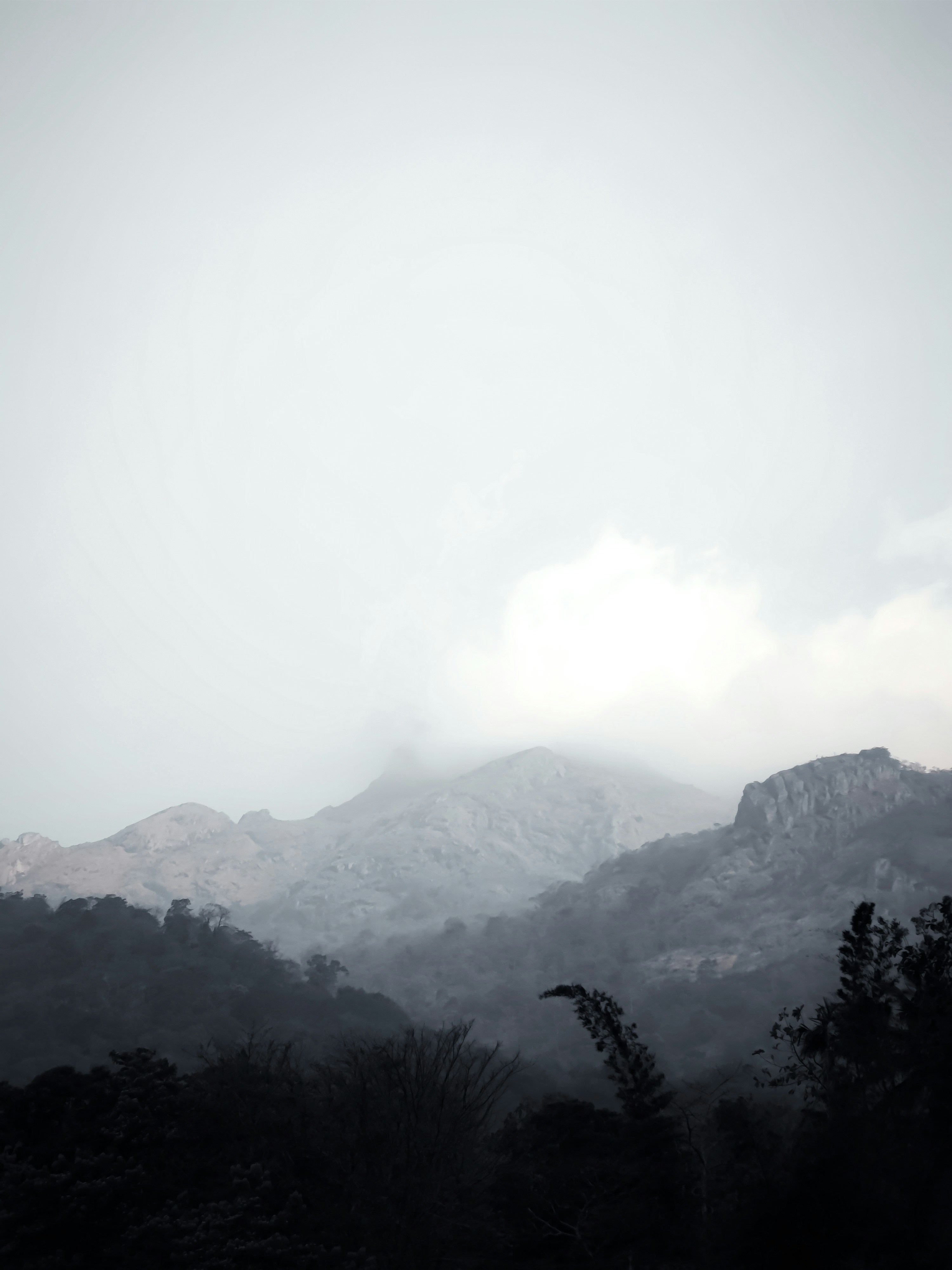 a black and white photo of a mountain range