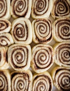 a close up of a plate of cinnamon rolls