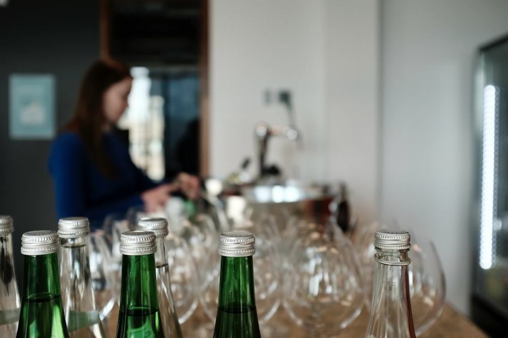 a table topped with empty wine glasses and bottles