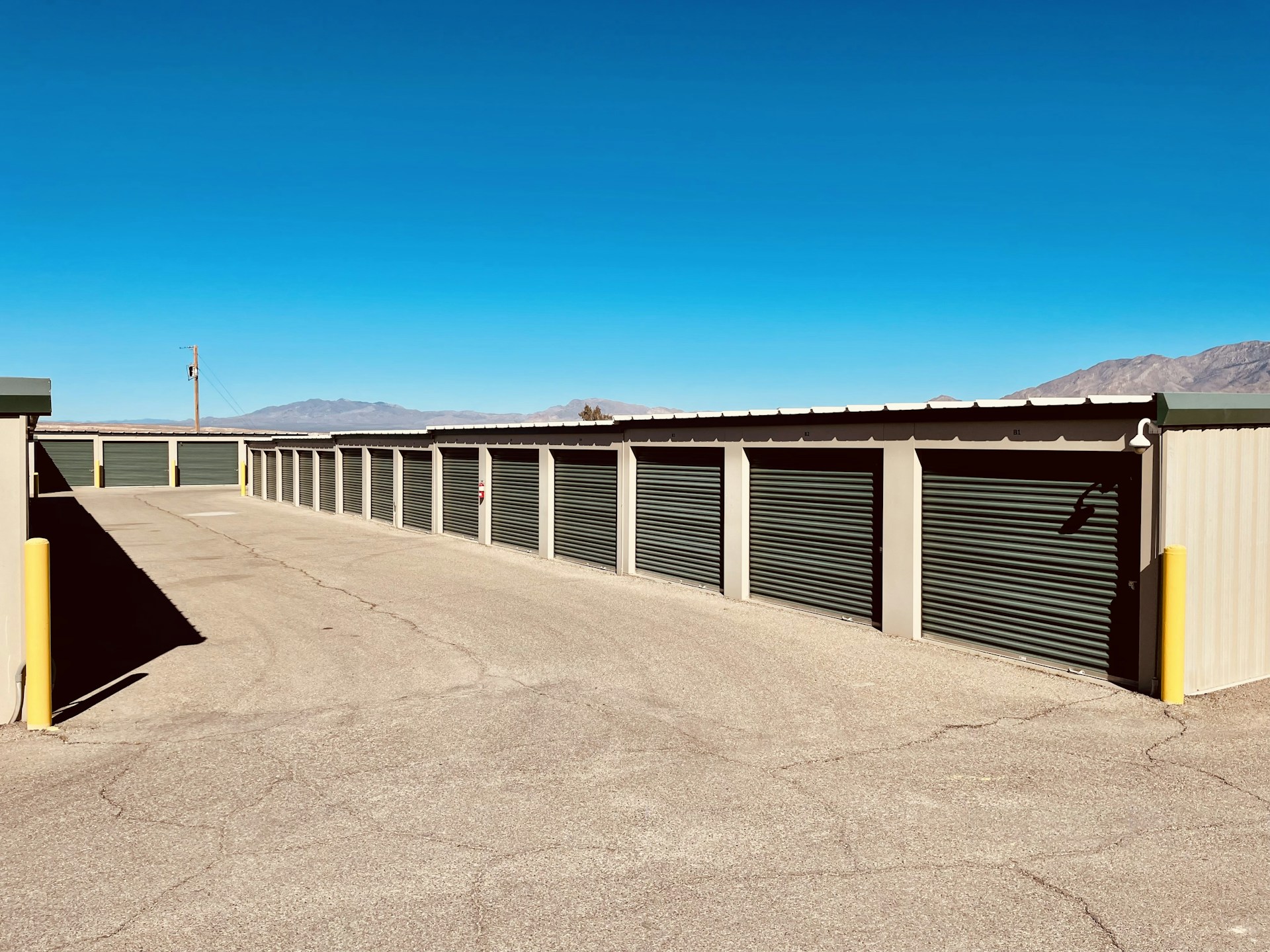 a row of storage units in a parking lot