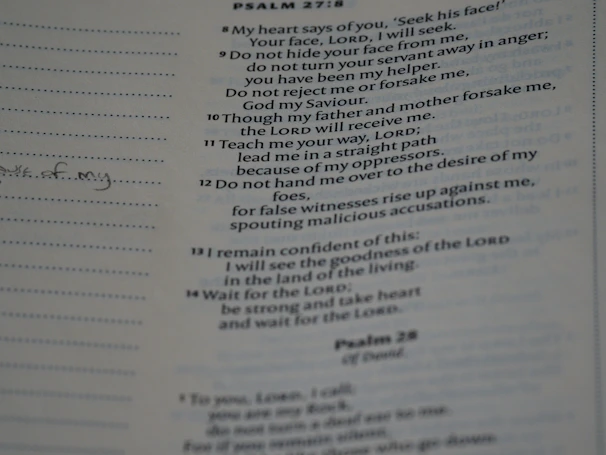 Close-up of a hymn book open to a page of confessional Lutheran songs.