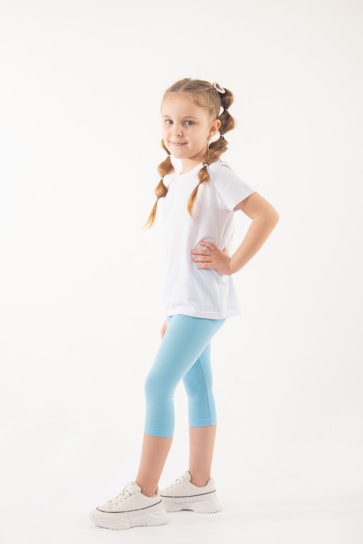 Teenage girl confidently posing in a modern outfit from isabelaemaysastore