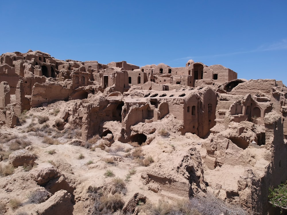 a group of buildings built into the side of a mountain