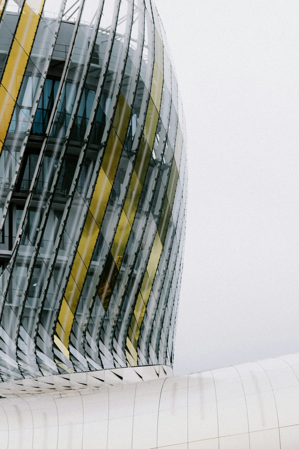 a man riding a skateboard next to a tall building