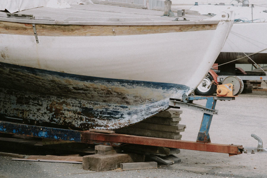 A boat being worked on while on its trailer
