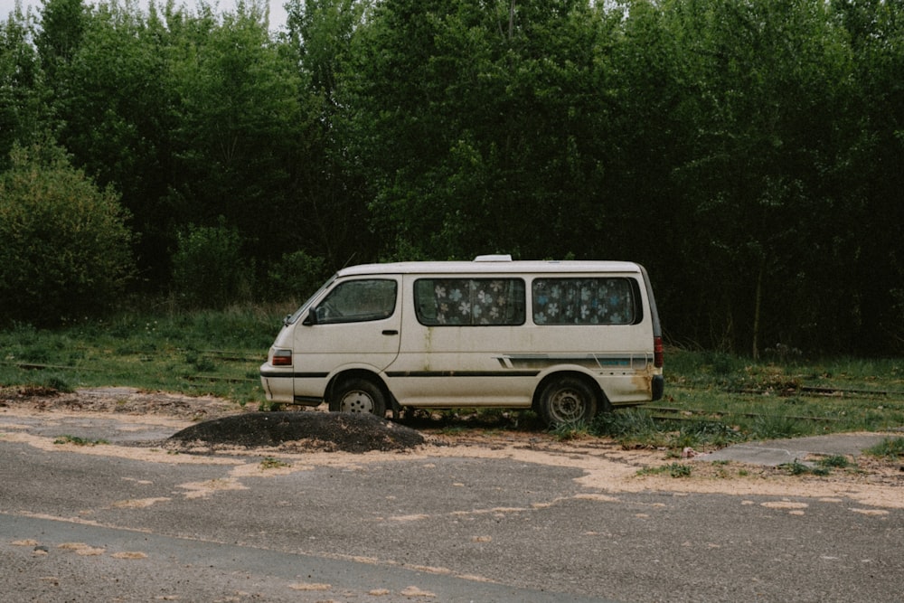 a van that is sitting in the dirt