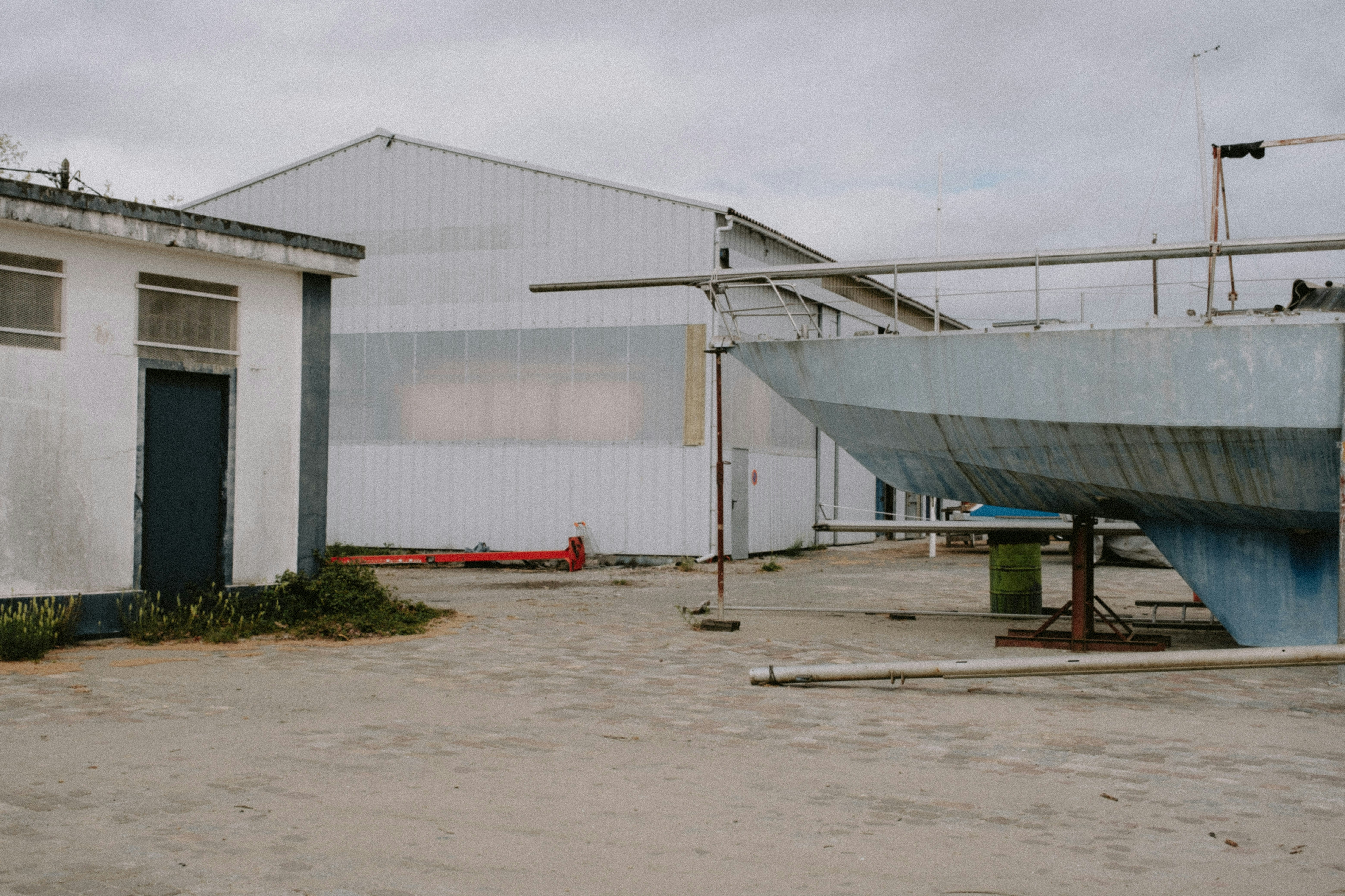 a boat sitting in front of a building