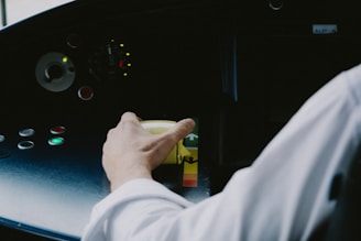 Technician operating a tow truck control panel.