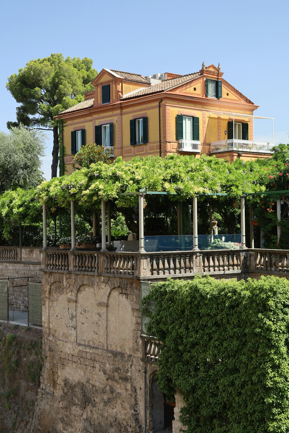 a house with a pool in front of it