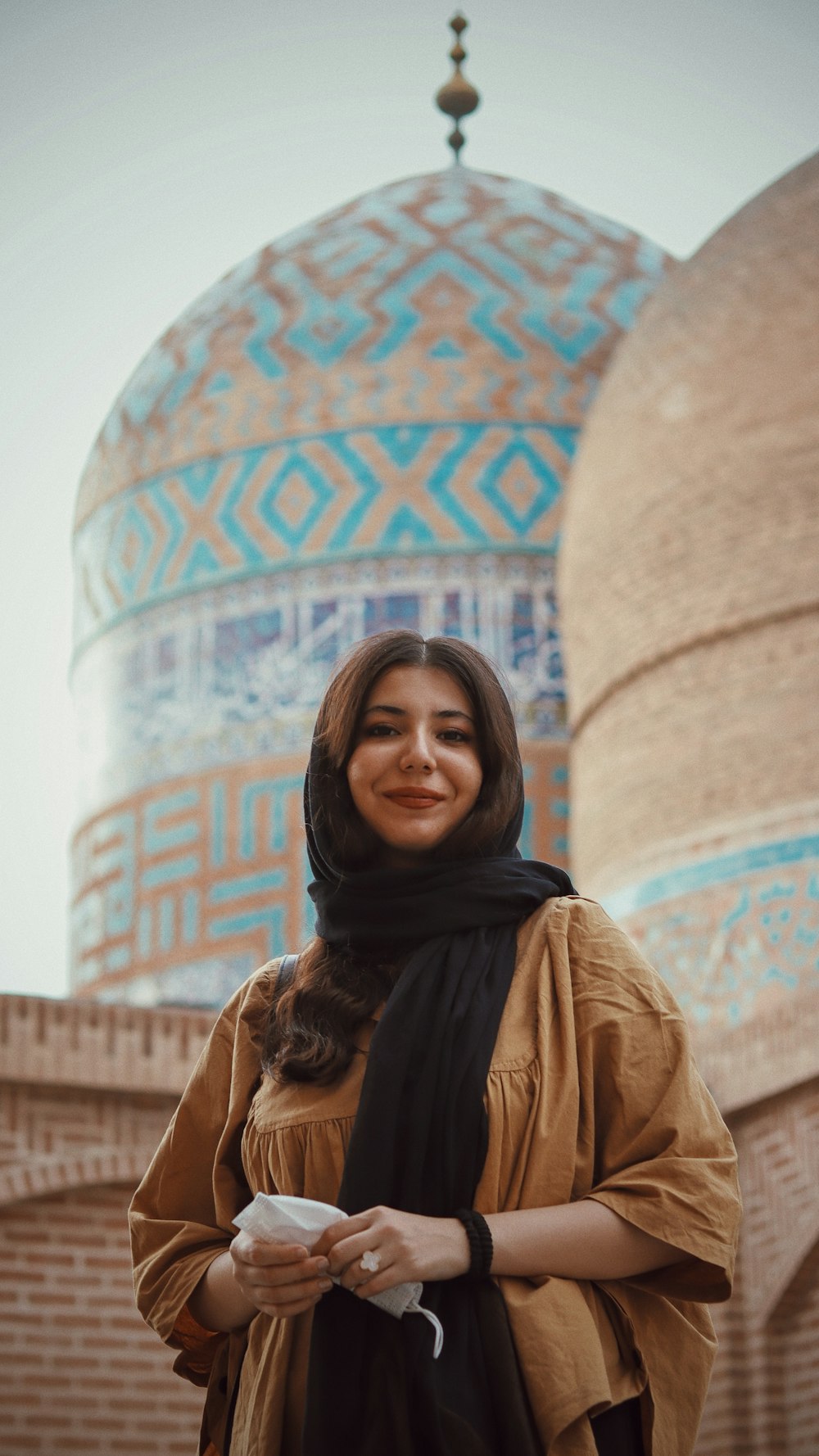 a woman standing in front of a building