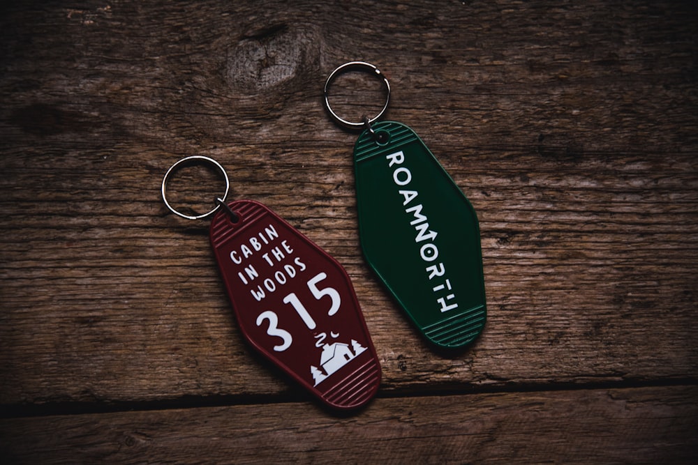 a pair of key chains with a name tag