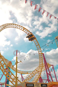 A cheerful UK family enjoying a sunny day at an Orlando theme park, with colorful rides and palm trees in the background.