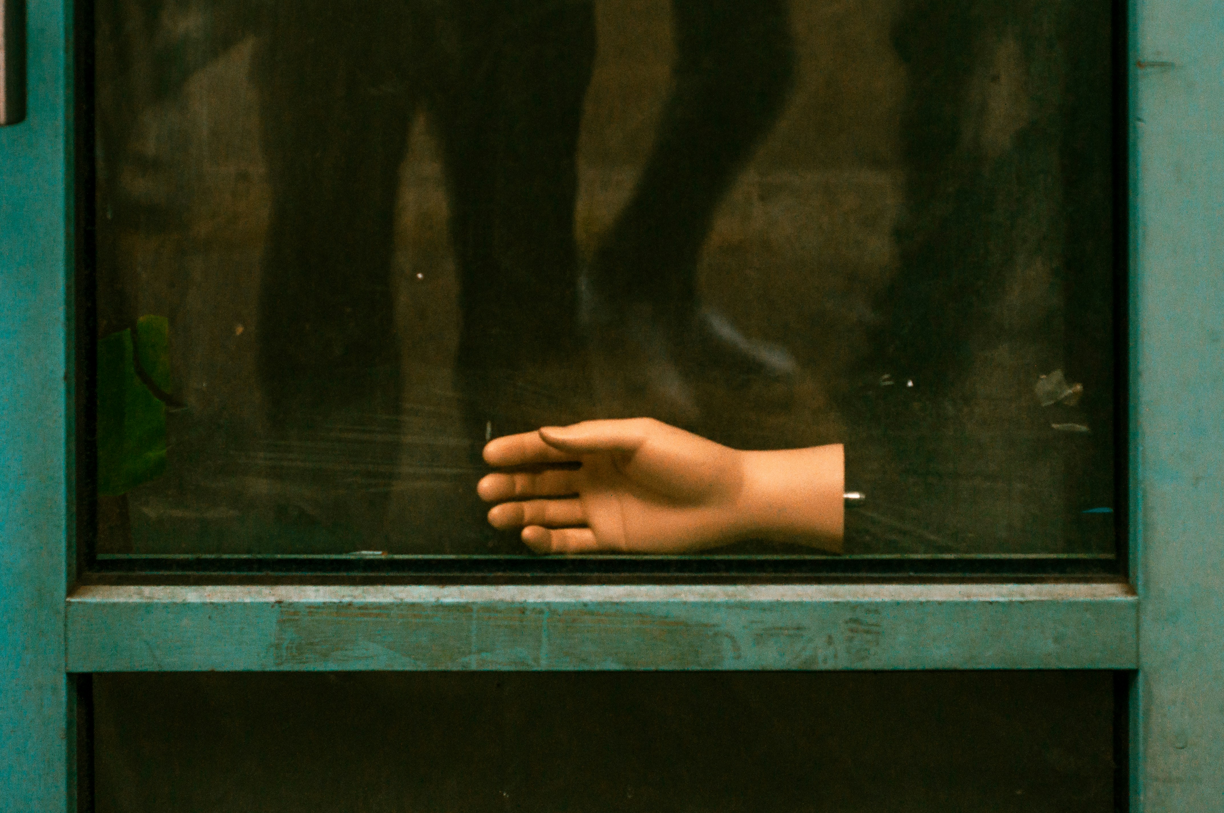 A person's hand sticking out of a window photo – Free Berlin street ...