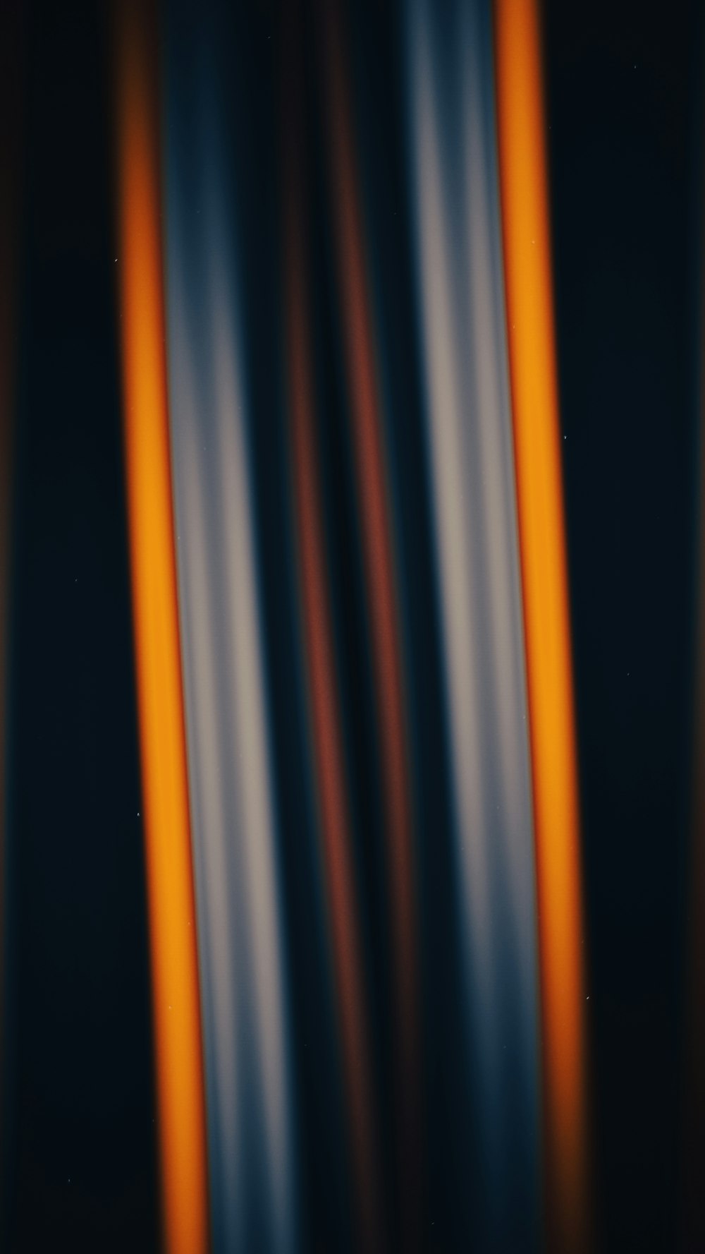 a blurry image of orange and blue lines