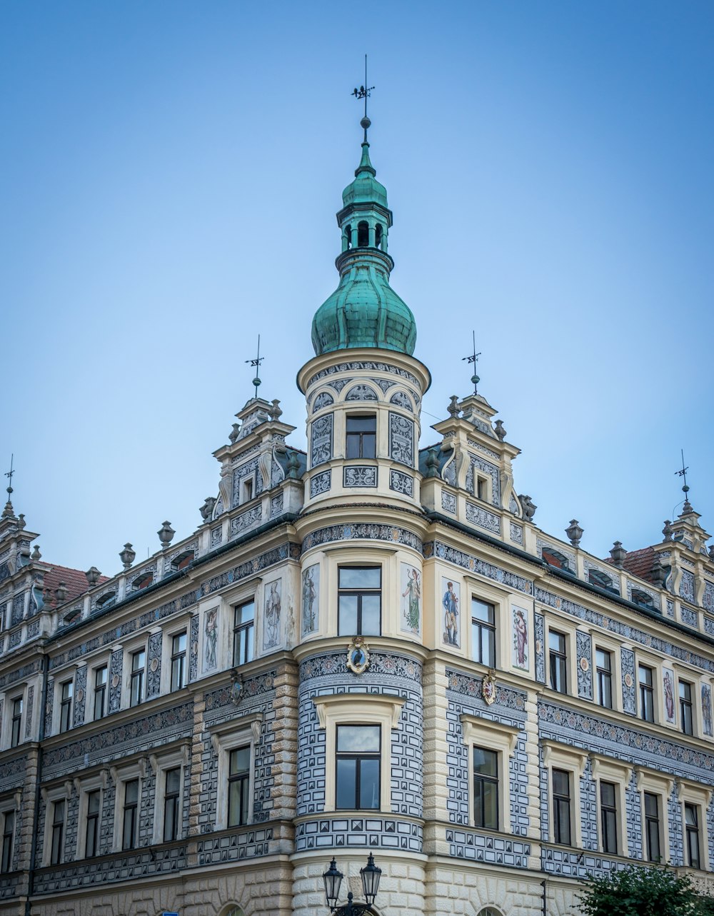 a large building with a green steeple on top