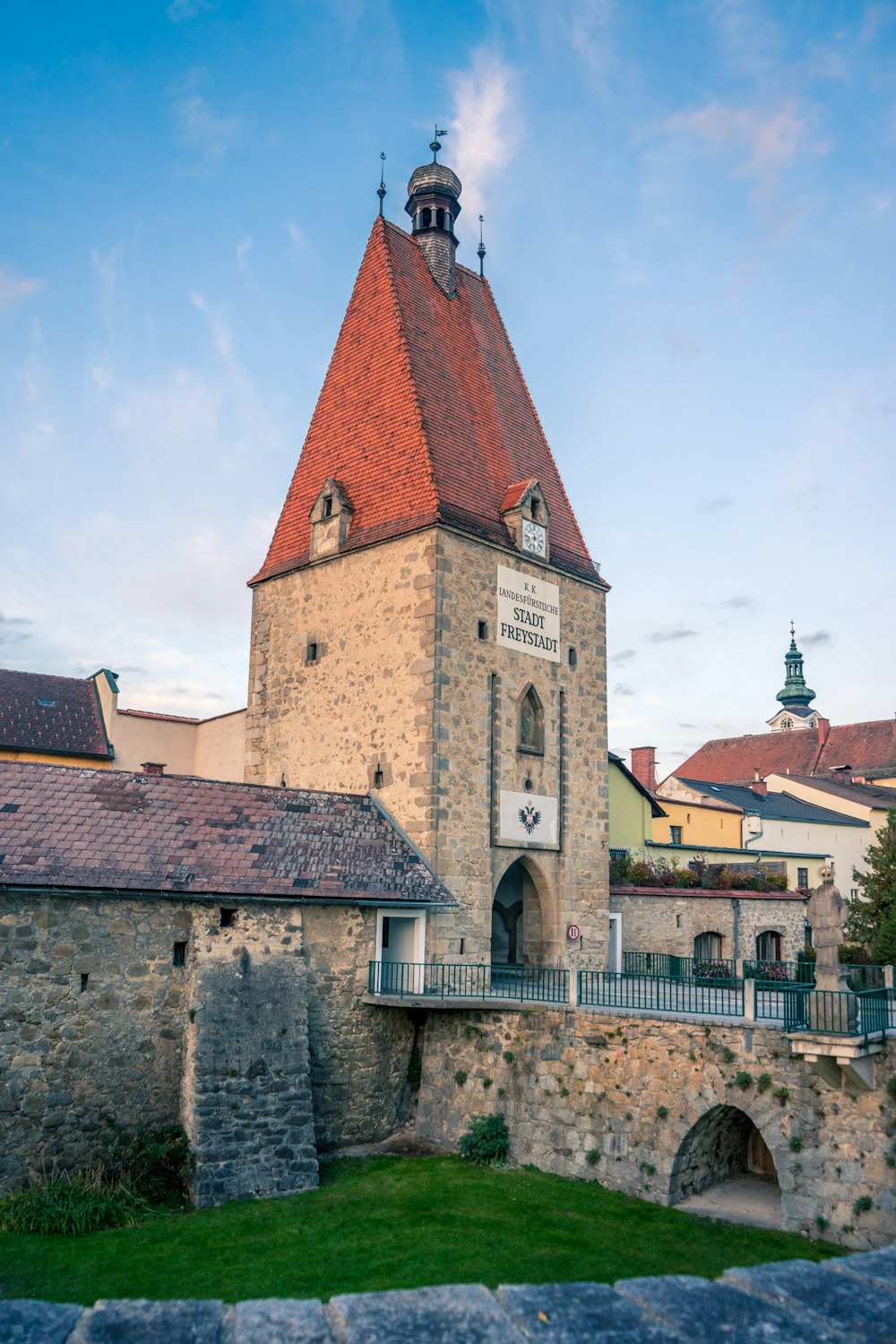 an old building with a tower with a clock on it