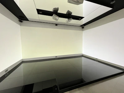 Modern living room showcasing sleek, dark ceramic floor tiles.