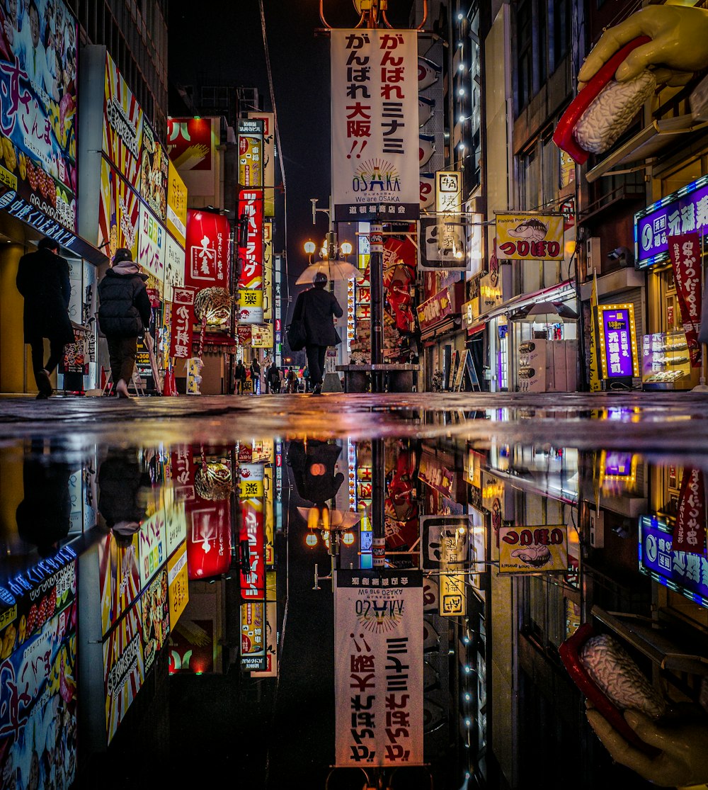 a city street filled with lots of neon signs