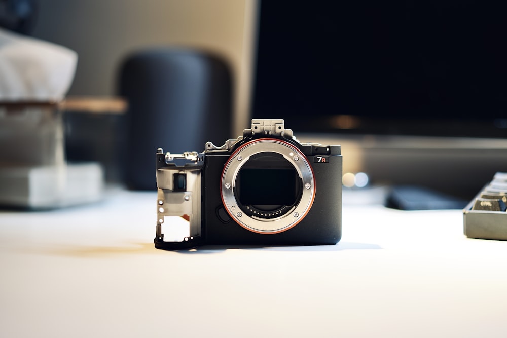 a camera sitting on top of a white table