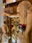 Close-up of a beautifully detailed Christian canvas print hanging above a wooden console.