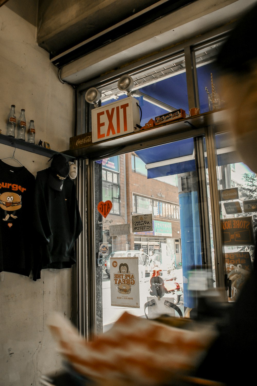 a store window with a sign that says exit